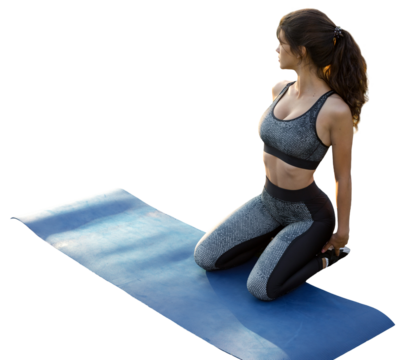 A young slim athletic girl in sportswear with snakeskin prints performs a set of exercises. Fitness and healthy lifestyle.