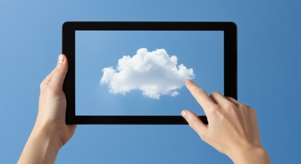 Cloud Computing Hands touch a digital cloud on a tablet screen against a blue sky.