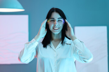 Young woman with VR glasses in modern art gallery