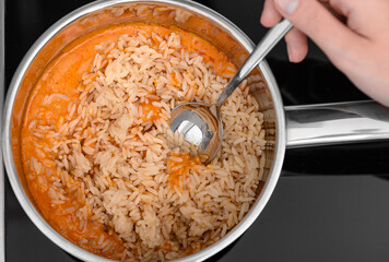 Risotto with chicken in vegetable sauce cooked in a pot