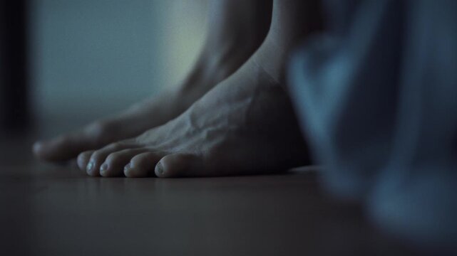 The man's bare feet land on the wooden floor, lingering in close-up as he slowly rises from the bed, and in that moment there is a sense of slight drowsiness and the beginning of a new day