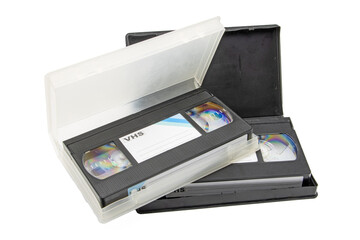 Close-up of video cassettes in their cases, isolated on white background