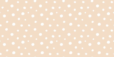 Abstract white polka dot pattern on soft beige background. Minimalist and versatile design.	