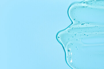 Texture of snail mucin gel on blue background