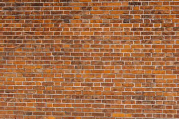 The texture of the red brick wall background. Clinker brick. A brick background wall. Grunge, a pattern on the wall. Brick wallpaper. Ideal for backgrounds, textures, and construction-related