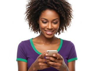 Young african american woman with curly dark hair smiling while holding and looking at her smartphone, isolated on transparent background