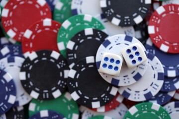 Dice game on the poker table in the casino. A successful combination of dice brought a lot of winning chips