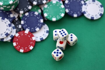 Dice game on the poker table in the casino. A successful combination of dice brought a lot of winning chips