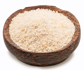 Manioc or cassava flour in wooden bowl on white background. File contains clipping path.