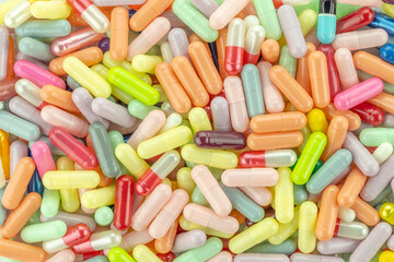 Colorful pills and capsules background. Medical, pharmacy, and healthcare treatment concept for wallpaper.
