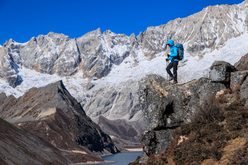 Fototapeta premium Successful woman hiker on high altitude mountain top
