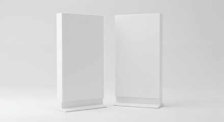 Pair of Blank White Vertical Banner Stand Mockups on a Minimalist Studio Background