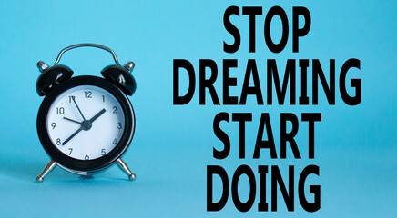 Stop Dreaming Start Doing symbol. Beautiful blue background with alarm clock. Business and Stop...