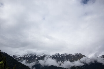 alpine mountains and clouds landscape background