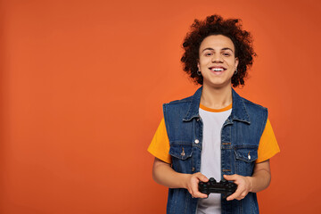 Young gamer with curly hair enjoys gaming in a vibrant setting full of energy and style