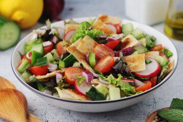 A bowl with Fattoush - Traditional Levantine salad