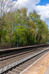 Obraz premium English British Rail Railways passenger suburban station. Commuter traffic in the suburbs of the West Midlands England UK. 