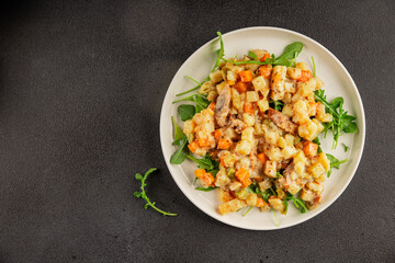Potato salad with smoked fish tasty snack fresh delicious gourmet food background on the table rustic food top view copy space