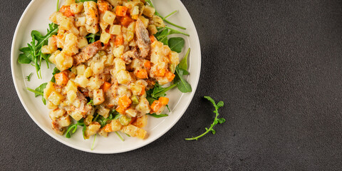 Potato salad with smoked fish tasty snack fresh delicious gourmet food background on the table rustic food top view copy space