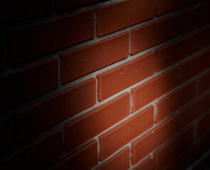 Close-Up of a Red Brick Wall with Spotlight and Vignette Effect