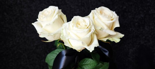 flower - white rose with black silk ribbon, the flower of remembrance