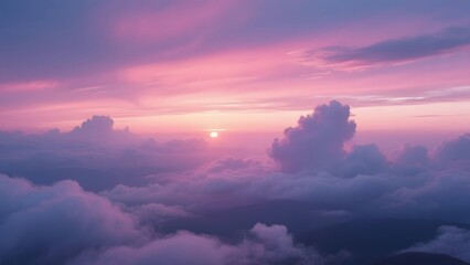 Aerial View of a Stunning Pink and Purple Sunset Above the Clouds