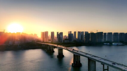 Fototapeta premium Urban Bridge with Illuminated Cityscape at Sunset - Creative Journey Photography with Golden Light and Dramatic Shadows