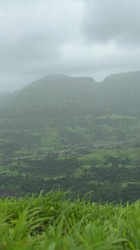 Vertical timelapse of Matheran mountain range with Peb fort in the backdrop, Matheran, Maharashtra