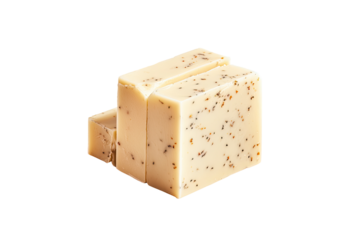 Stacked bar of light beige soap with speckled dark seeds