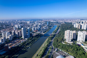 Aerial view of Marginal Pinheiros alongside Rio Pinheiros in Sao Paulo showcasing the urban landscape. Residential and commercial buildings in Sao Paulo