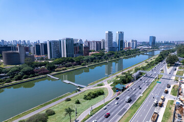 Aerial view of Marginal Pinheiros alongside Rio Pinheiros in Sao Paulo showcasing the urban landscape. Residential and commercial buildings in Sao Paulo