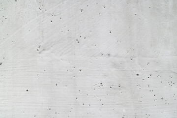 Closeup detail of raw concrete texture for backgrounds, construction concept, or architectural design projects needing a gritty, industrial feel.