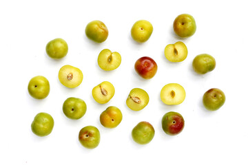 Fresh green plum fruit on white background.