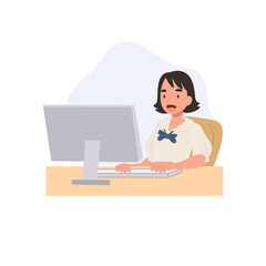 a student in uniform works on computer for homework and online lessons depicting education concept