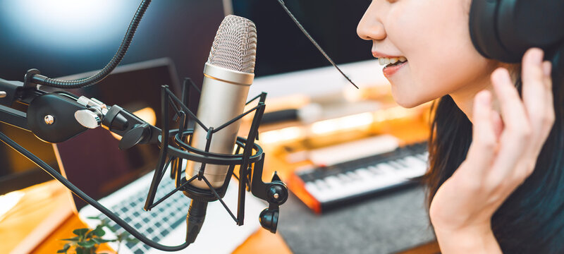 Asian woman singing with microphone making song vtuber gen z trend lifestyles with digital technology