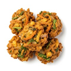 Golden brown vegetable fritters with visible ingredients on white background pakora snack
