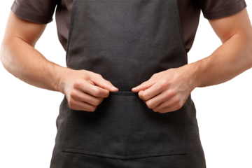 A person adjusting an apron, ready for cooking or serving in a culinary environment, on white isolated background.