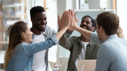 A group of people are high fiving each other in a room