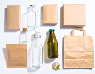 Eco branding flatlay: Here description and keywords for image, formatted as requested eco branding flatlay glass container kraft paper packaging shows simplicity clean