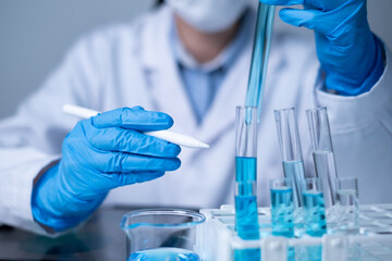 Fototapeta premium Professional healthcare medical worker doctor working for new discovery of medicine to treat disease and cancer patient research laboratory report document data analysis pharmacy future planning