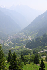 Picturesque alpine landscape with green valley and mountain forest in Switzerland