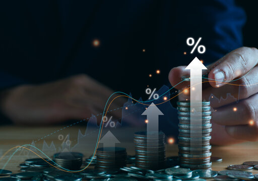 Save money for investment concept. Stack of coins with trading chart in financial, stock market, wealth economy, interest rate, Inflation and tax.
