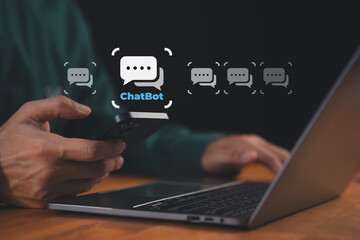 Person using smartphone and laptop with chatbot icons floating on screen. Concept of AI chatbot, customer support automation, assistant, online communication, messaging technology, digital service.