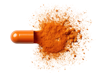 Open orange capsule spills turmeric powder
