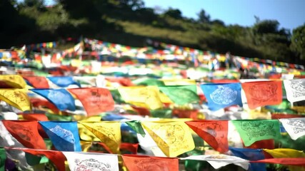 Colorful prayer flags fluttering in the wind in the mountains - Powered by Adobe