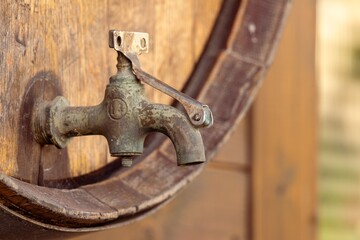Vintage wine barrel with metal spigot