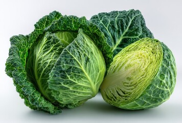 Fototapeta premium Fresh green cabbages with vibrant leaves and textured outer layers, isolated on a white background