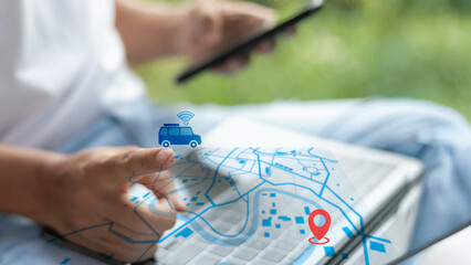 Close-up hand using a GPS tracking map with a smart car icon and a location pin on a digital screen. Concept of real-time navigation, transport, and mobility.