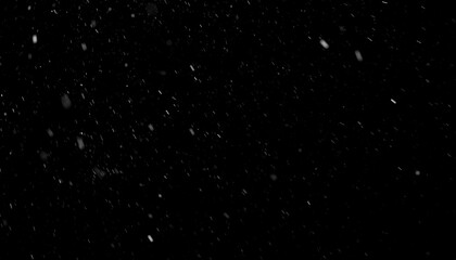 Obraz premium Falling Snowflakes Against a Black Background