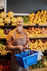 Salesman engaging customers in vibrant organic grocery store environment